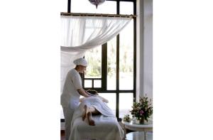 a woman getting a massage in a room at Berbère Palace in Ouarzazate