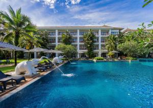 a pool at a resort with animals in the water at Naithonburi Beach Resort in Nai Thon Beach