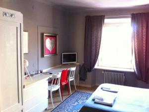 TV a/nebo společenská místnost v ubytování Residenza Navona Verona + 25 fotografií