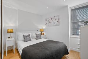 Letto o letti in una camera di Berwick Street by Q Apartments