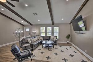 a living room with a couch and a tv at Canal-Front Cape Coral Home: Pool & Patio in Cape Coral