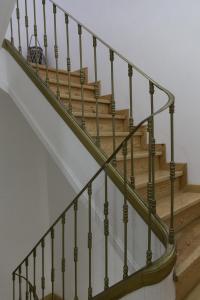 a set of stairs with a metal railing at Varandas do Nabão in Tomar