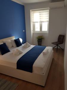 Posteľ alebo postele v izbe v ubytovaní Marina Rijeka Center apartments