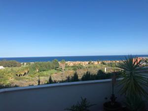 a view of the ocean from a balcony at La casa Ana in Casares