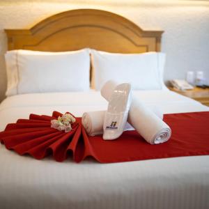 Postel nebo postele na pokoji v ubytování Hotel Horizon & Convention Center