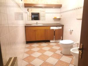 a bathroom with a toilet and a sink at Residence La Lanterna in Genova +45 photos