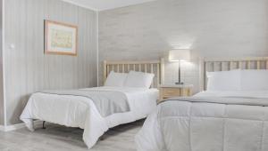 Postel nebo postele na pokoji v ubytování North Creek Lodge at Gore Mountain