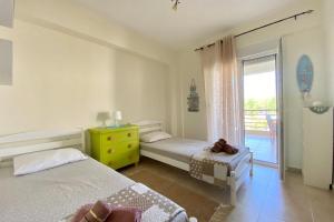 Posteľ alebo postele v izbe v ubytovaní Siviri Luxury Apartment Cleopatra