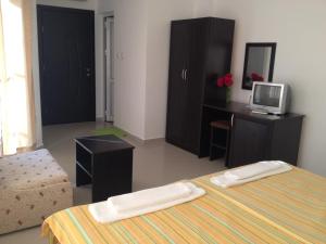Postel nebo postele na pokoji v ubytování Hotel Paradise