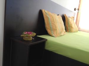 Postel nebo postele na pokoji v ubytování Hotel Paradise