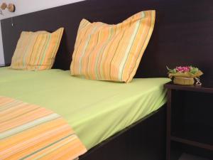 Postel nebo postele na pokoji v ubytování Hotel Paradise