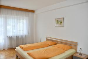 Кровать или кровати в номере Haus Klavenz