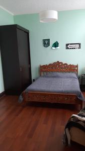 Postel nebo postele na pokoji v ubytování Hostal Dinamarca