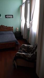 Postel nebo postele na pokoji v ubytování Hostal Dinamarca