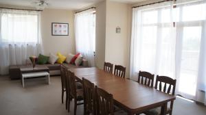 a living room with a table and a couch at Summer Breeze Villa in Balchik