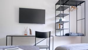 TV a/nebo společenská místnost v ubytování Agritur Deromedi