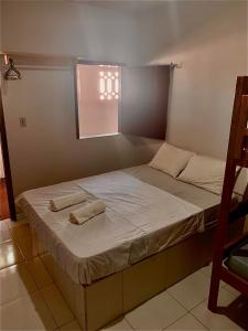 Ліжко або ліжка в номері Pousada Sol Dourado