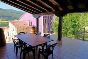 a table and chairs sitting on a patio at Casa Rural La Campana Con o sin Ático in San Millán de la Cogolla