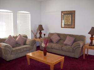 a living room with two couches and a coffee table at Sunsplash Vacation Homes in Davenport