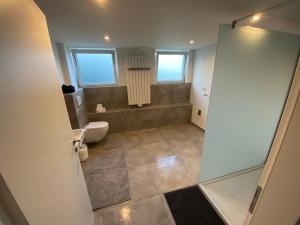 Koupelna v ubytování Vogelnest + 13 fotografií