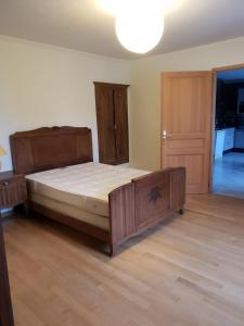 a bedroom with a large bed in a room at Appartement in Saint-Bresson