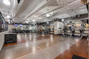 a large room with a wooden floor in a gym at Level Vancouver Yaletown - Seymour in Vancouver