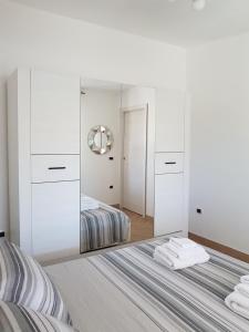 Ένα ή περισσότερα κρεβάτια σε δωμάτιο στο Cottage Vacanze La Maddalena