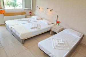 Postel nebo postele na pokoji v ubytování Hotel Stella
