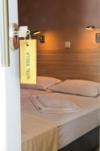 Postel nebo postele na pokoji v ubytování Hotel Stella