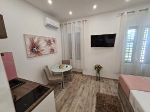 TV a/nebo společenská místnost v ubytování D&D Suites in Split Centre