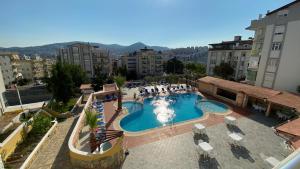 an overhead view of a swimming pool in a city at Oya Family Suites in Kuşadası