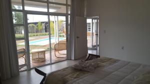 A bed or beds in a room at Hotel Terrazas del rio Negro