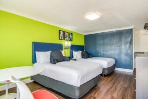 Voodi või voodid majutusasutuse Signature Inn Eugene toas