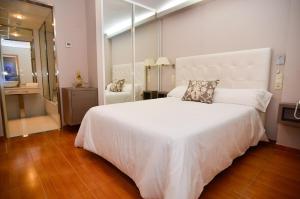 Postel nebo postele na pokoji v ubytování Hotel Jucamar