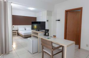 A cozinha ou cozinha compacta de Best Western Suites Le Jardin Caldas Novas