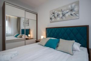 Postel nebo postele na pokoji v ubytování Bora Bora Apartmani Zlatibor