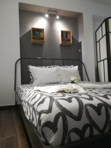 a black and white bed in a room at Studios of the Panteão, 0th floor in Lisbon