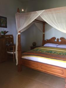 Postel nebo postele na pokoji v ubytování Bali Cottage Sambirenteng