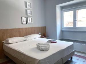 Postel nebo postele na pokoji v ubytování Sognalibro Bed and Books