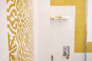 a bathroom with a shower with a mirror and a sink at Casa Marino in Sorrento