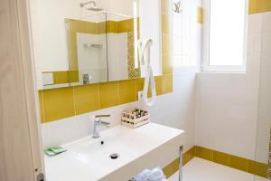 a bathroom with a sink and a mirror at Casa Marino in Sorrento