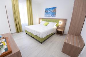 a hotel room with a bed and a table at Casa Marino in Sorrento