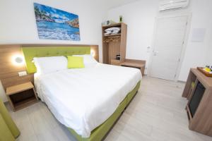 a bedroom with a large bed and a television at Casa Marino in Sorrento