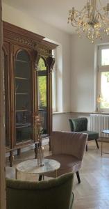 a living room with a couch and a mirror at Boutique Hotel Villa Horbach in Idar-Oberstein