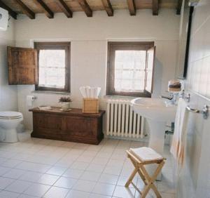 a bathroom with a sink and a toilet at Residenza Antica Canonica in Città di Castello