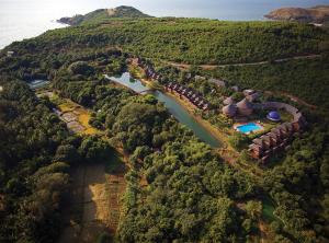 an aerial view of the resort and the river at SwaSwara Gokarna - a CGH Earth Experience in Gokarna
