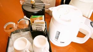 a coffee cup sitting on top of a counter next to a blender at ANA Holiday Inn Sendai, an IHG Hotel in Sendai