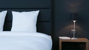 Voodi või voodid majutusasutuse Hotel St James toas