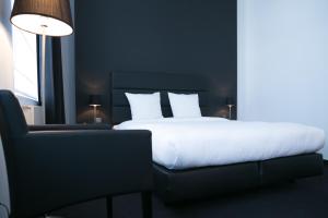 Voodi või voodid majutusasutuse Hotel St James toas