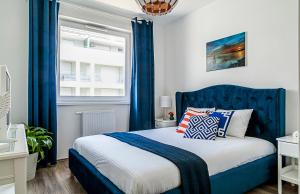 Кровать или кровати в номере Blue Apartments